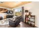 Living room featuring wood ceiling, large window with view, and comfortable seating at 1091 Mcfarland St, Dunedin, FL 34698