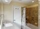 Bathroom featuring a single vanity, tile floors, and a shower/tub combo at 1101 King Arthur Ct, Valrico, FL 33594