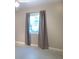 Bedroom with neutral walls, carpeted floor, and natural light at 1101 King Arthur Ct, Valrico, FL 33594