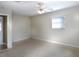 Bedroom with neutral walls, carpeted floor, and a ceiling fan at 1101 King Arthur Ct, Valrico, FL 33594