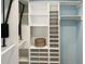 Custom closet with ample shelving and pull-down hanging racks at 1101 King Arthur Ct, Valrico, FL 33594