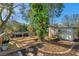 Relaxing backyard wooden deck featuring a comfy hammock and nature's beauty at 1242 Holly Cir, Oldsmar, FL 34677