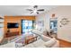 Inviting living room featuring a sliding glass door, modern furniture, and hardwood floors at 1242 Holly Cir, Oldsmar, FL 34677