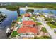 An aerial view shows the waterfront home with a dock and a boat lift at 1336 51St Ne Ave, St Petersburg, FL 33703