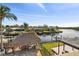 Waterfront home with a large patio, tiki hut, boat dock, and canal views at 1336 51St Ne Ave, St Petersburg, FL 33703