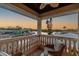 Balcony boasts tranquil water view, elegant stone railings, and outdoor seating area at 1336 51St Ne Ave, St Petersburg, FL 33703