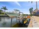 A dock and boat lift on the canal is ready for the next adventure at 1336 51St Ne Ave, St Petersburg, FL 33703