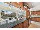 Kitchen island with barstools overlooks the pool and backyard at 1336 51St Ne Ave, St Petersburg, FL 33703