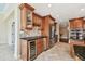 Well-equipped kitchen featuring wood cabinetry, granite countertops, and stainless steel appliances at 1336 51St Ne Ave, St Petersburg, FL 33703