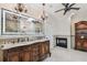 Elegant main bathroom with fireplace, dual vanities, tile flooring, and decorative chandeliers at 1336 51St Ne Ave, St Petersburg, FL 33703