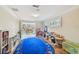 Bright playroom with tile flooring, lots of toys, and a large, colorful alphabet rug at 1336 51St Ne Ave, St Petersburg, FL 33703