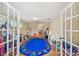 Spacious playroom with tile flooring, lots of toys, and a large, colorful alphabet rug at 1336 51St Ne Ave, St Petersburg, FL 33703