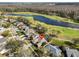 Beautiful aerial view of a home on a golf course with a pond at 1401 Ventana Dr, Sun City Center, FL 33573