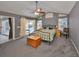 Spacious main bedroom featuring gray walls, vaulted ceilings, and sliding glass doors leading to the pool at 1401 Ventana Dr, Sun City Center, FL 33573