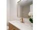 Chic bathroom featuring a marble countertop, gold fixtures, and modern sink at 14810 Feather Cove Ln, Clearwater, FL 33762