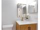 Bathroom with a modern sink, marble countertop, modern mirror, and brushed gold fixtures at 14810 Feather Cove Ln, Clearwater, FL 33762