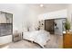 Bright main bedroom with ensuite bathroom, large window, and vaulted ceiling at 14810 Feather Cove Ln, Clearwater, FL 33762