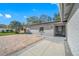 Gray brick home showcasing the front door and brick-paved driveway at 16324 Bonneville Dr, Tampa, FL 33624