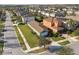 Aerial view of a neighborhood featuring manicured lawns, well-spaced houses, and sidewalks for walking and recreation at 17596 Terrazzo Way, Land O Lakes, FL 34638