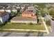 An aerial view showcases a residential neighborhood with lush greenery and manicured lawns surrounding well-maintained homes at 17596 Terrazzo Way, Land O Lakes, FL 34638