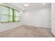 Bright bedroom with neutral carpet, white walls and ceiling fan with window coverings at 17596 Terrazzo Way, Land O Lakes, FL 34638