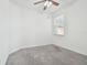 Bright bedroom with neutral carpet, ceiling fan, and window with blinds at 17596 Terrazzo Way, Land O Lakes, FL 34638