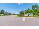 Welcoming community entrance with attractive signage, landscaping, and well-maintained streets at 17596 Terrazzo Way, Land O Lakes, FL 34638