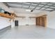 Well-lit garage with built-in shelving and epoxy flooring at 17596 Terrazzo Way, Land O Lakes, FL 34638