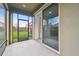 View from lanai with screen door and sliding glass door to the home at 17596 Terrazzo Way, Land O Lakes, FL 34638