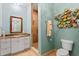 Bright bathroom with tiled shower, granite counters, and decorative coastal theme at 2028 Illinois Ne Ave, St Petersburg, FL 33703