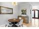 Chic dining room with tiled floor, designer chandelier, and sophisticated wall art at 2028 Illinois Ne Ave, St Petersburg, FL 33703