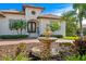 Close-up of the home's front facade, showcasing the architectural details and fountain at 2028 Illinois Ne Ave, St Petersburg, FL 33703