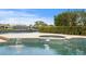 Backyard pool with an integrated spa and tranquil water feature at 2028 Illinois Ne Ave, St Petersburg, FL 33703