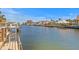 Scenic view of a waterway lined with docks and boats and views of waterfront homes on a sunny day at 2028 Illinois Ne Ave, St Petersburg, FL 33703