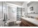 Bright bathroom with a shower-tub combination and a dark wood vanity at 2086 Whitney N Pl, Clearwater, FL 33760