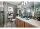 Modern bathroom featuring a glass shower, wood vanity, and stylish fixtures at 2086 Whitney N Pl, Clearwater, FL 33760