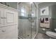 Bright bathroom showcasing a glass-enclosed shower and a clean, organized space at 2086 Whitney N Pl, Clearwater, FL 33760