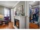 Elegant fireplace flanked by a closet and an entry to the main room at 2086 Whitney N Pl, Clearwater, FL 33760