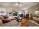 Inviting living area with hardwood floors, a plush rug, and neutral tones, creating a cozy and comfortable atmosphere at 2086 Whitney N Pl, Clearwater, FL 33760