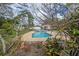 Landscaped backyard showcasing a refreshing pool and spa, perfect for relaxation and enjoying the outdoor scenery at 2086 Whitney N Pl, Clearwater, FL 33760