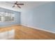 Spacious bedroom with hardwood floors, and a window for natural light at 212 Arbor Woods Cir, Oldsmar, FL 34677