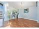 Open-concept living room and kitchen with hardwood floors and light blue walls at 212 Arbor Woods Cir, Oldsmar, FL 34677