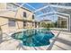 The screened-in pool area is perfect for outdoor fun with great house views at 212 Arbor Woods Cir, Oldsmar, FL 34677