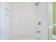 Walk-in shower with white tile and modern showerhead at 212 Arbor Woods Cir, Oldsmar, FL 34677