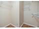 Walk-in closet with white walls, wire shelving and wood floors at 212 Arbor Woods Cir, Oldsmar, FL 34677