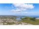 Sweeping aerial view captures the neighborhood close to open water and wetlands at 217 S Mcmullen Booth Rd # 179, Clearwater, FL 33759