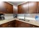 Beautiful kitchen featuring granite countertops, stainless steel sink and updated cabinetry at 217 S Mcmullen Booth Rd # 179, Clearwater, FL 33759