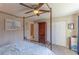 Main bedroom featuring a canopy bed, carpet, and ceiling fan at 217 S Mcmullen Booth Rd # 179, Clearwater, FL 33759