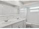 Bright bathroom features double sinks, generous counter space and a bath tub and shower combination at 2195 Glen Dr, Safety Harbor, FL 34695