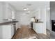 This kitchen features sleek white cabinets, granite counters, and stainless steel appliances at 2195 Glen Dr, Safety Harbor, FL 34695